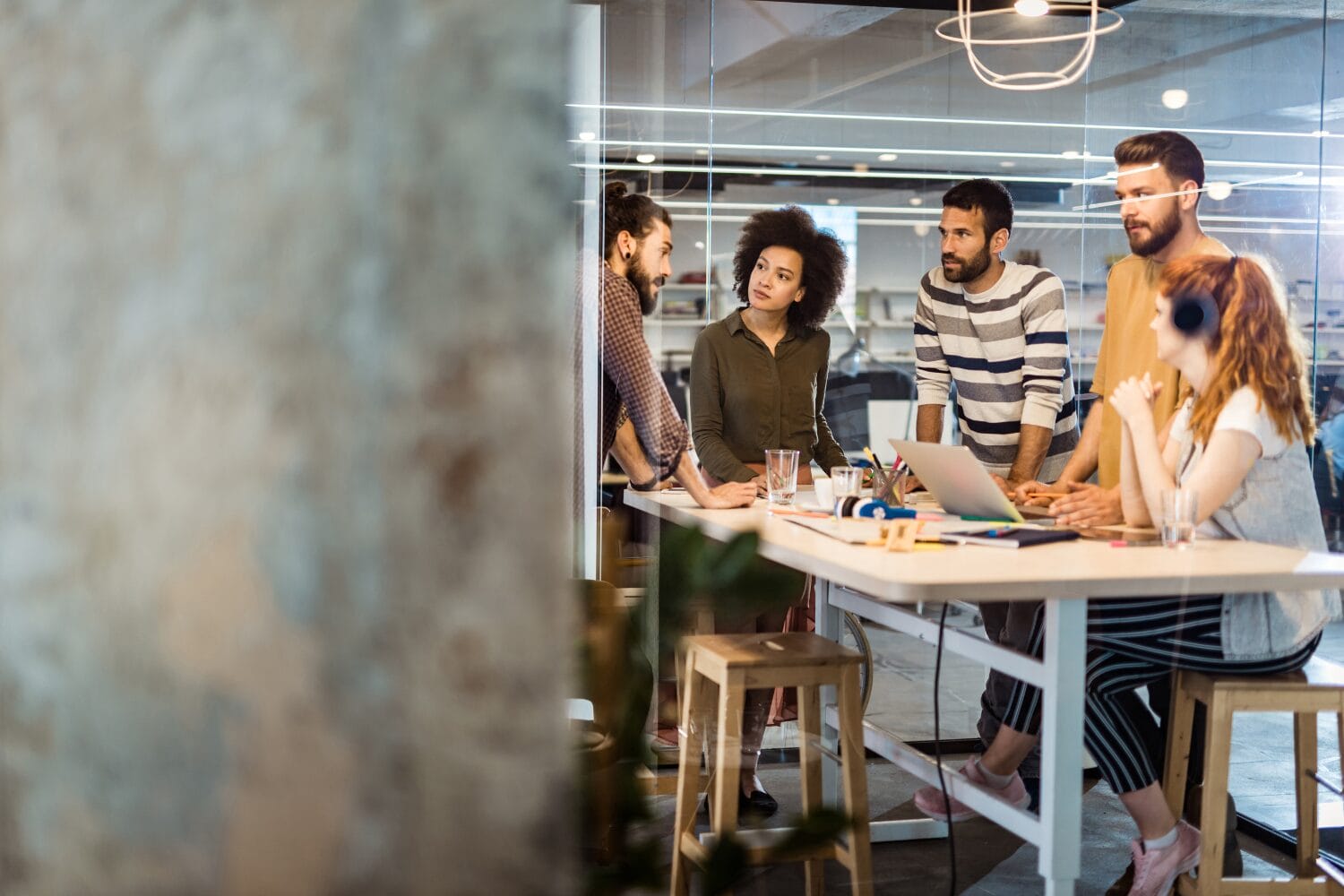 Office people talking around a lunch room table